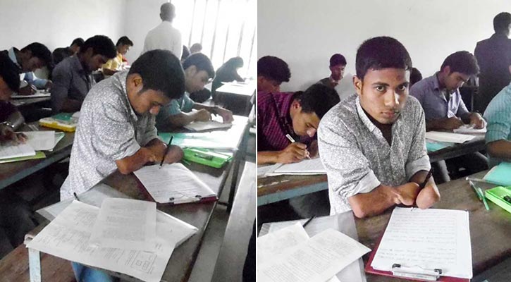কব্জি দিয়ে লিখে পরীক্ষা দিচ্ছে শাহ আলম কব্জি দিয়ে লিখে পরীক্ষা দিচ্ছে শাহ আলম